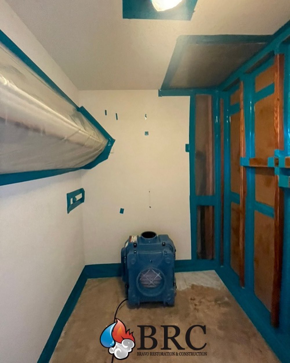 A room with blue paint and a blue fan, in need of water damage remediation experts.